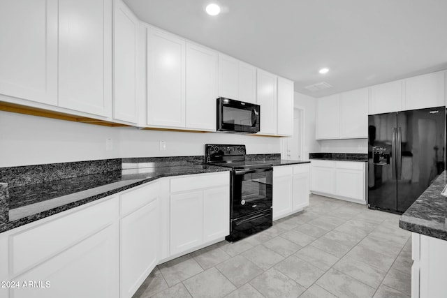 kitchen with black appliances, dark stone counters, and white cabinets