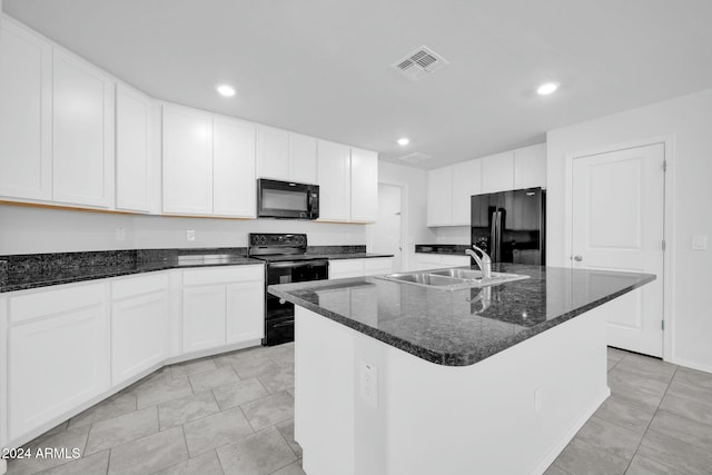 kitchen featuring white cabinets, sink, a kitchen island with sink, and black appliances