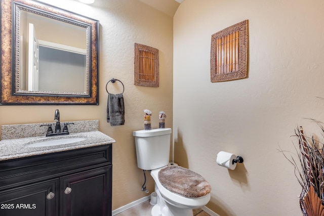 965 E Virgo Pl, Chandler, AZ 85249 - half bathroom featuring vanity, toilet, and baseboards