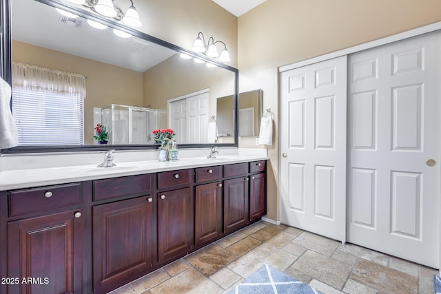965 E Virgo Pl, Chandler, AZ 85249 - full bathroom featuring stone tile floors, a shower stall, and double vanity