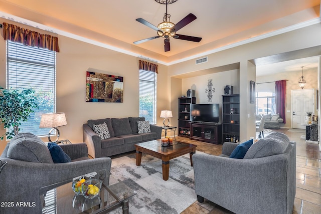 965 E Virgo Pl, Chandler, AZ 85249 - living room with ceiling fan and a raised ceiling