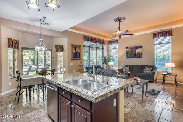 965 E Virgo Pl, Chandler, AZ 85249 - kitchen with stone tile floors, a sink, dishwasher, and a tray ceiling