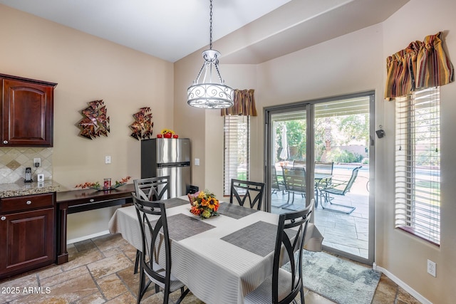 965 E Virgo Pl, Chandler, AZ 85249 - dining area with stone tile flooring and baseboards
