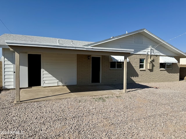 back of house with a patio area