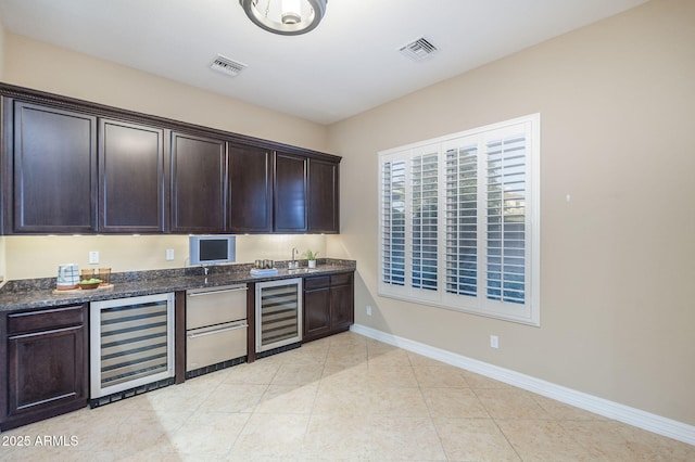 5243 E Windstone Trl, Cave Creek, AZ 85331 - bar with beverage cooler and light tile patterned flooring