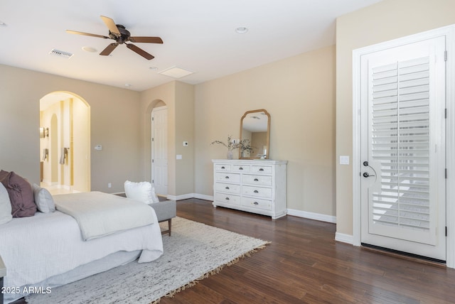 5243 E Windstone Trl, Cave Creek, AZ 85331 - bedroom with arched walkways, dark wood-type flooring, and a ceiling fan