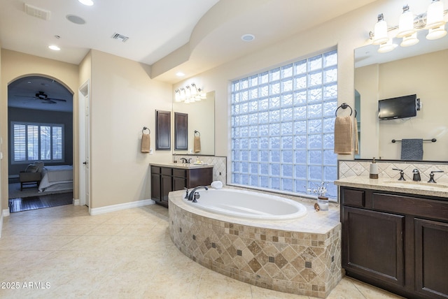 5243 E Windstone Trl, Cave Creek, AZ 85331 - ensuite bathroom with two vanities, a bath, tile patterned floors, ceiling fan, and recessed lighting