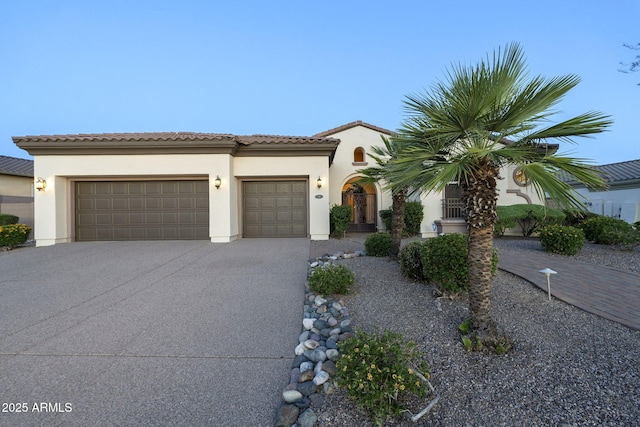 5243 E Windstone Trl, Cave Creek, AZ 85331 - mediterranean / spanish home with a garage, driveway, stucco siding, and a tile roof
