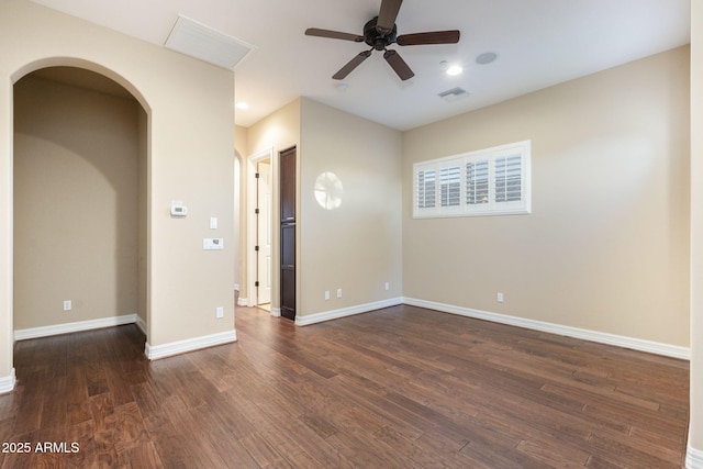 5243 E Windstone Trl, Cave Creek, AZ 85331 - spare room featuring arched walkways, ceiling fan, wood finished floors, and recessed lighting