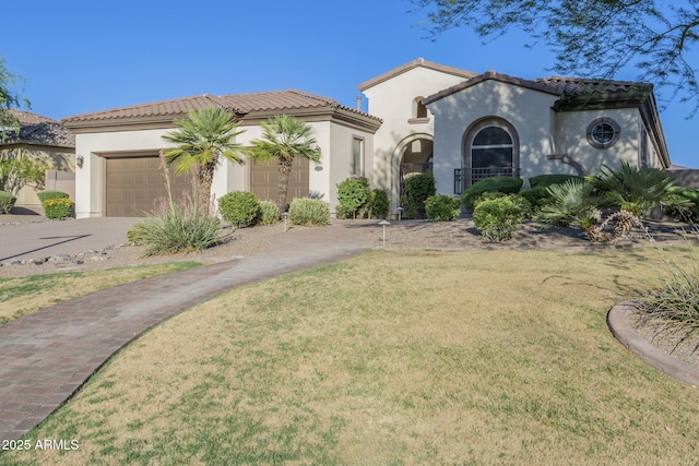 5243 E Windstone Trl, Cave Creek, AZ 85331 - mediterranean / spanish-style home featuring stucco siding, a garage, driveway, and a tile roof