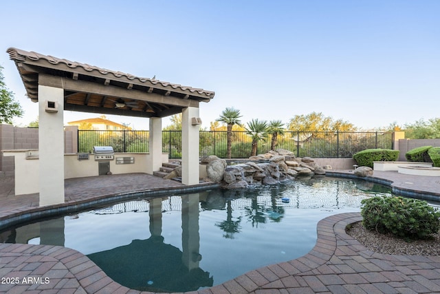 5243 E Windstone Trl, Cave Creek, AZ 85331 - view of pool with an outdoor kitchen, a fenced backyard, and ceiling fan