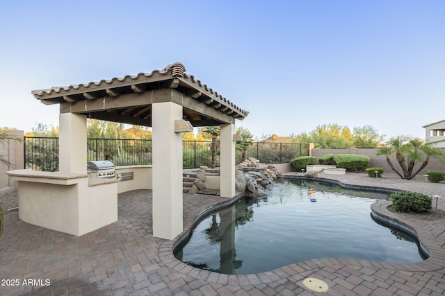 5243 E Windstone Trl, Cave Creek, AZ 85331 - view of swimming pool with exterior kitchen, a fenced backyard, a gazebo, and a patio