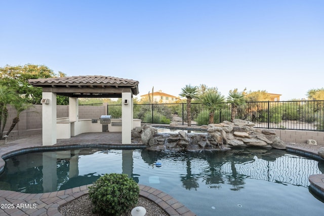 5243 E Windstone Trl, Cave Creek, AZ 85331 - view of swimming pool with an outdoor kitchen, a fenced backyard, a gazebo, and a patio area