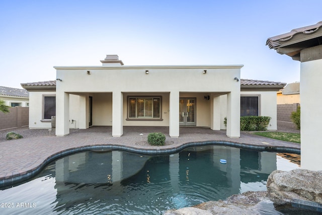 5243 E Windstone Trl, Cave Creek, AZ 85331 - outdoor pool with french doors and a patio area