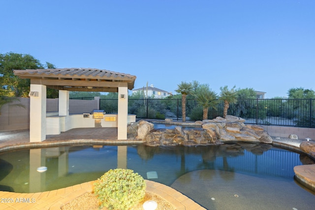 5243 E Windstone Trl, Cave Creek, AZ 85331 - view of swimming pool with an outdoor kitchen, a fenced backyard, and a gazebo