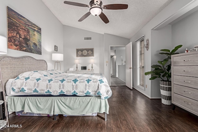 bedroom with ceiling fan, dark hardwood / wood-style floors, a textured ceiling, and vaulted ceiling