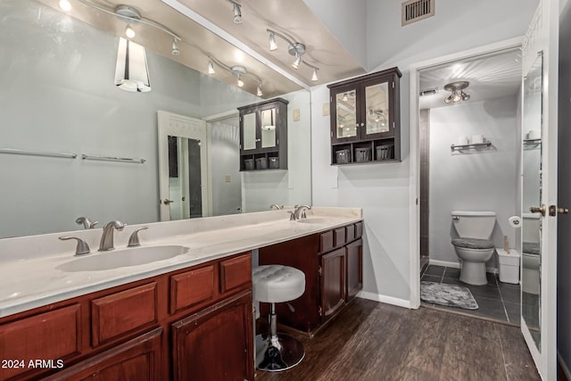 bathroom featuring hardwood / wood-style floors, vanity, and toilet