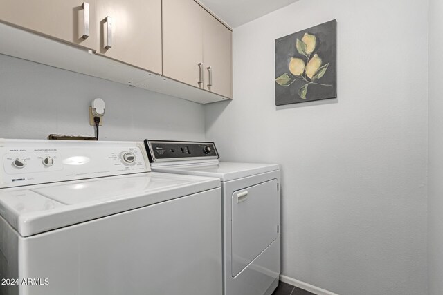 laundry room featuring cabinets and independent washer and dryer