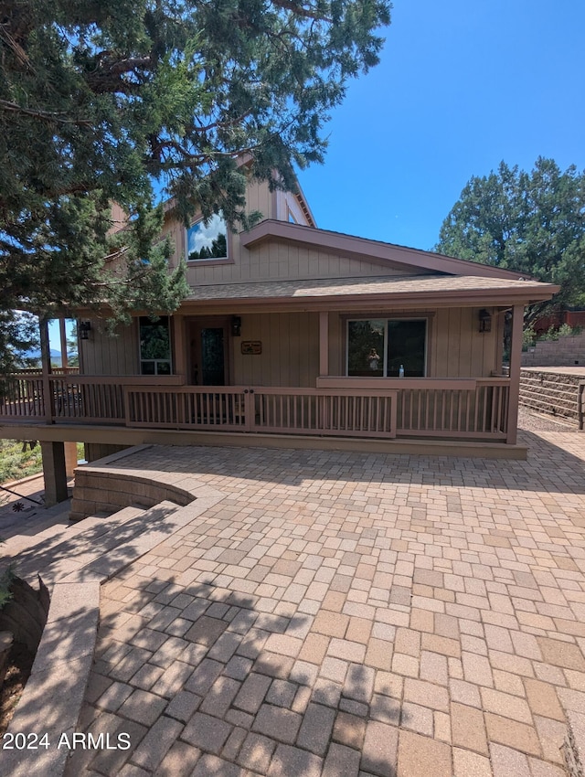 rear view of property featuring a patio