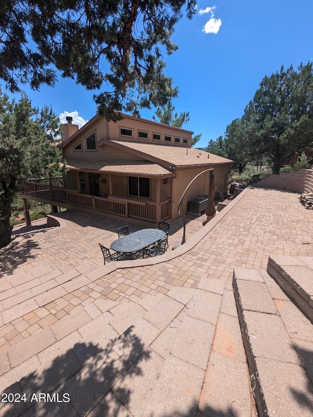 rear view of house with a patio