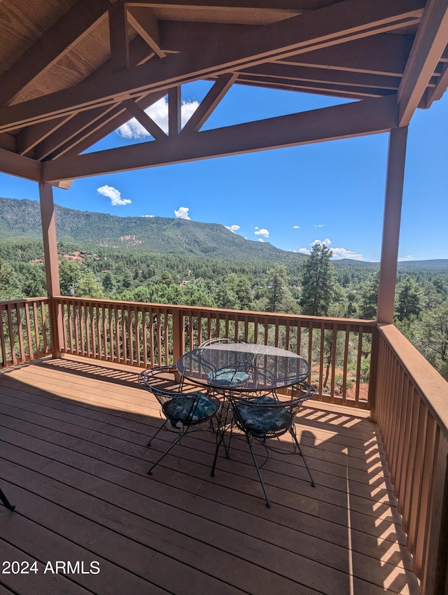 wooden terrace featuring a mountain view