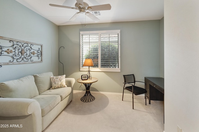 carpeted living room featuring ceiling fan