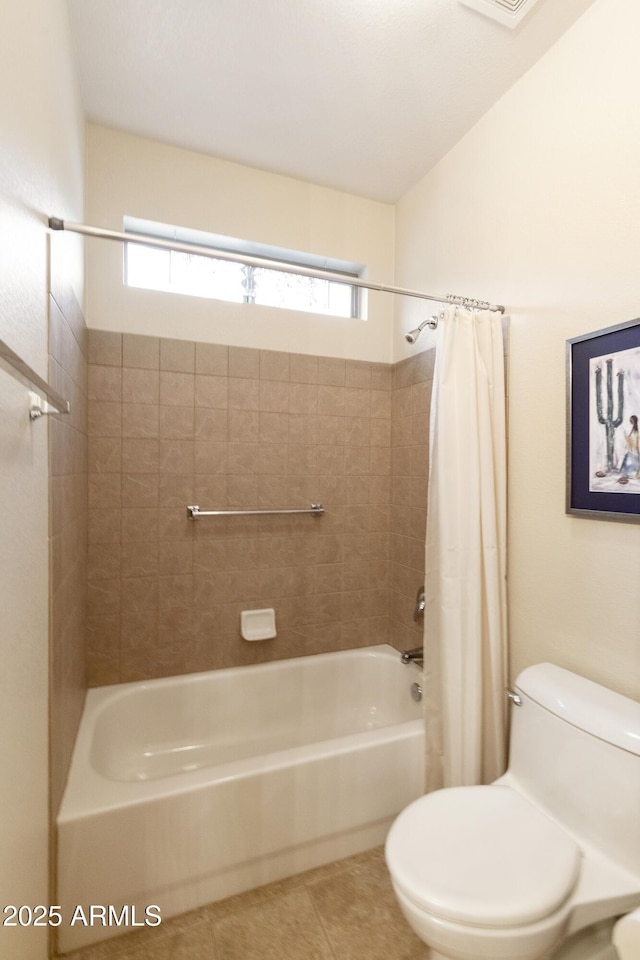 bathroom with shower / bath combination with curtain, tile patterned flooring, a healthy amount of sunlight, and toilet