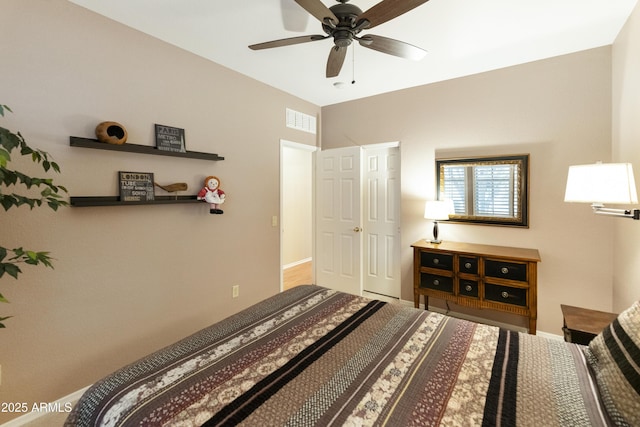 bedroom featuring ceiling fan and a closet