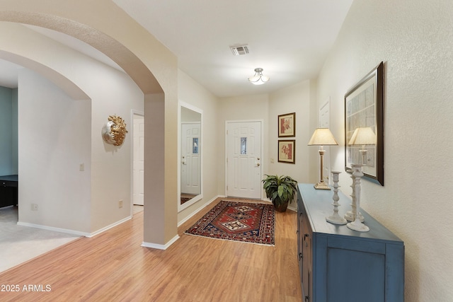 entrance foyer with light hardwood / wood-style flooring