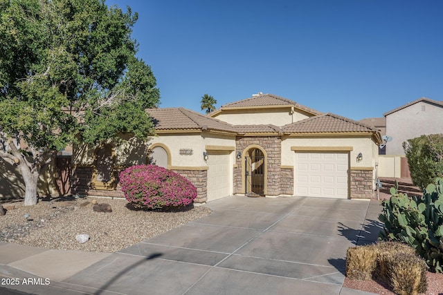 mediterranean / spanish-style home with a garage