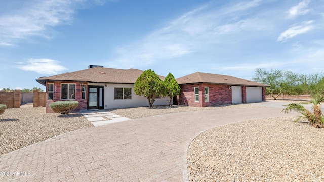 19401 W Flower St, Litchfield Park, AZ 85340 - single story home with curved driveway and brick siding