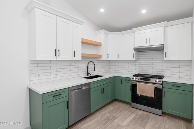 19401 W Flower St, Litchfield Park, AZ 85340 - kitchen with stainless steel appliances, a sink, under cabinet range hood, green cabinetry, and open shelves