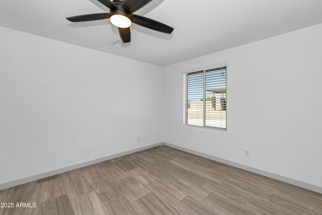 19401 W Flower St, Litchfield Park, AZ 85340 - unfurnished room featuring a ceiling fan, baseboards, and wood finished floors