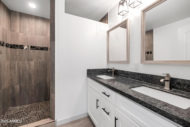 19401 W Flower St, Litchfield Park, AZ 85340 - full bath with walk in shower, double vanity, and wood finished floors