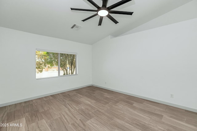 19401 W Flower St, Litchfield Park, AZ 85340 - unfurnished room featuring lofted ceiling, a ceiling fan, and baseboards