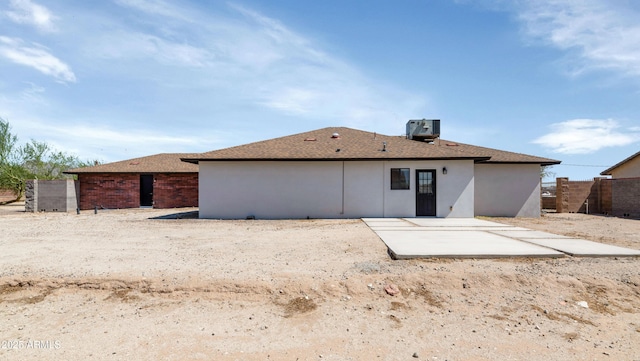 19401 W Flower St, Litchfield Park, AZ 85340 - back of house featuring a patio area, central air condition unit, stucco siding, and roof with shingles