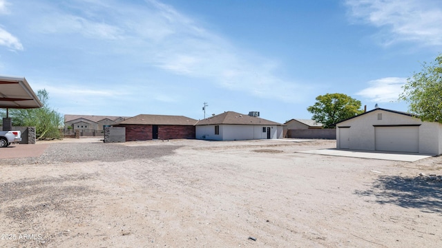 19401 W Flower St, Litchfield Park, AZ 85340 - back of property with an outdoor structure and a garage