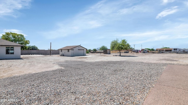 19401 W Flower St, Litchfield Park, AZ 85340 - view of yard featuring a detached garage and an outdoor structure