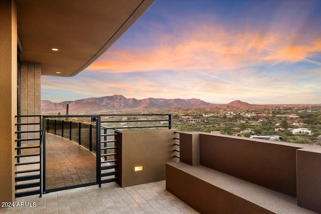 balcony at dusk with a mountain view