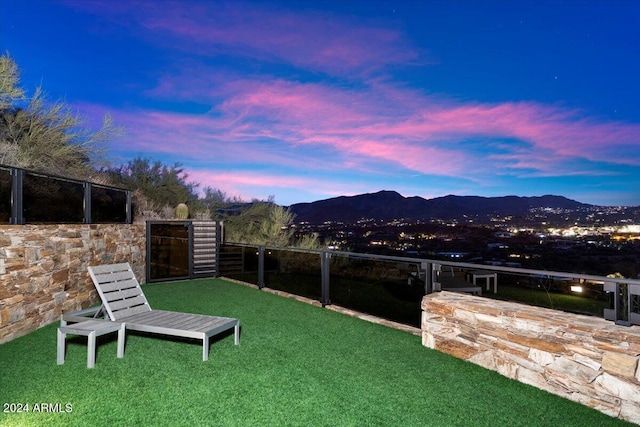 yard at dusk with a mountain view