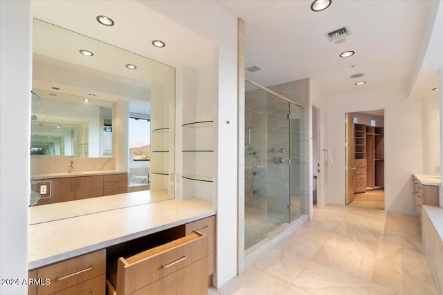 bathroom with an enclosed shower and vanity