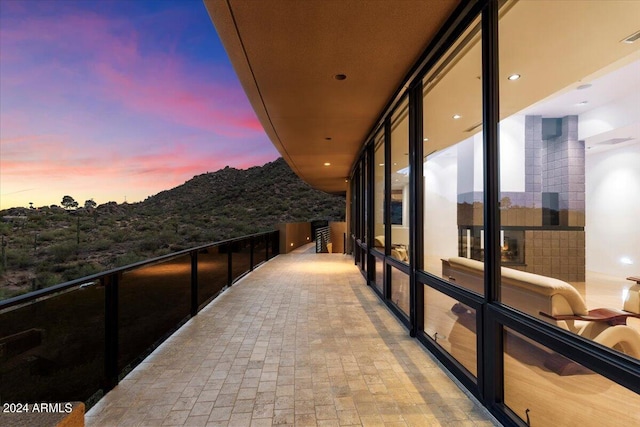 view of balcony at dusk