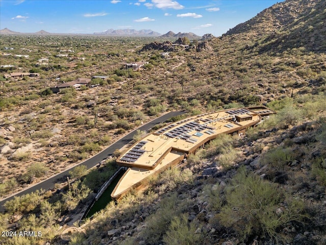 birds eye view of property featuring a mountain view