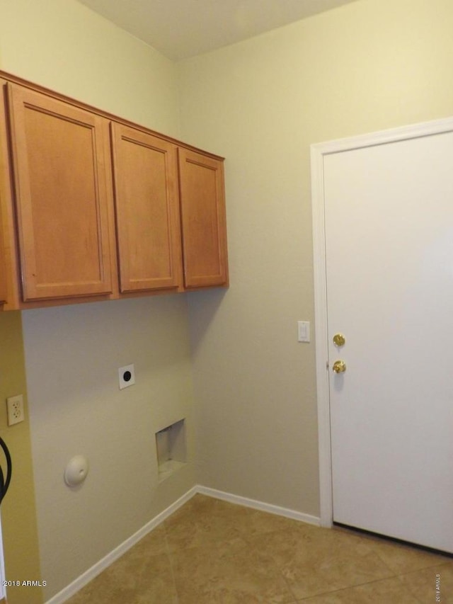 laundry area with cabinets and electric dryer hookup