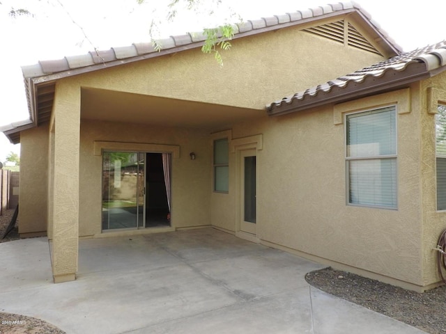 back of property with a patio area