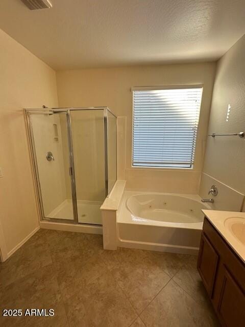 bathroom featuring tile patterned floors, separate shower and tub, and vanity