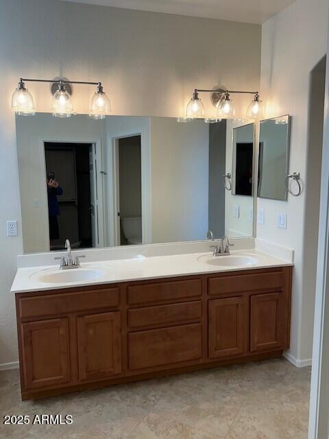 bathroom with toilet and vanity