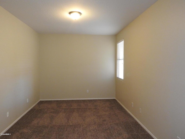 empty room with dark carpet