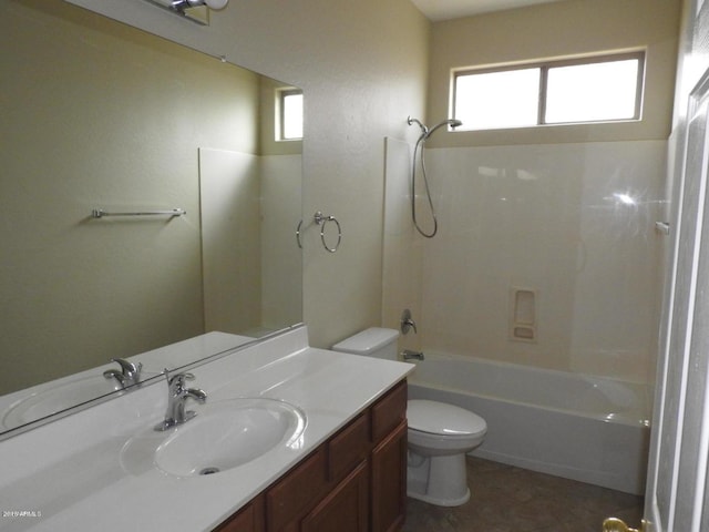 full bathroom featuring vanity, washtub / shower combination, and toilet