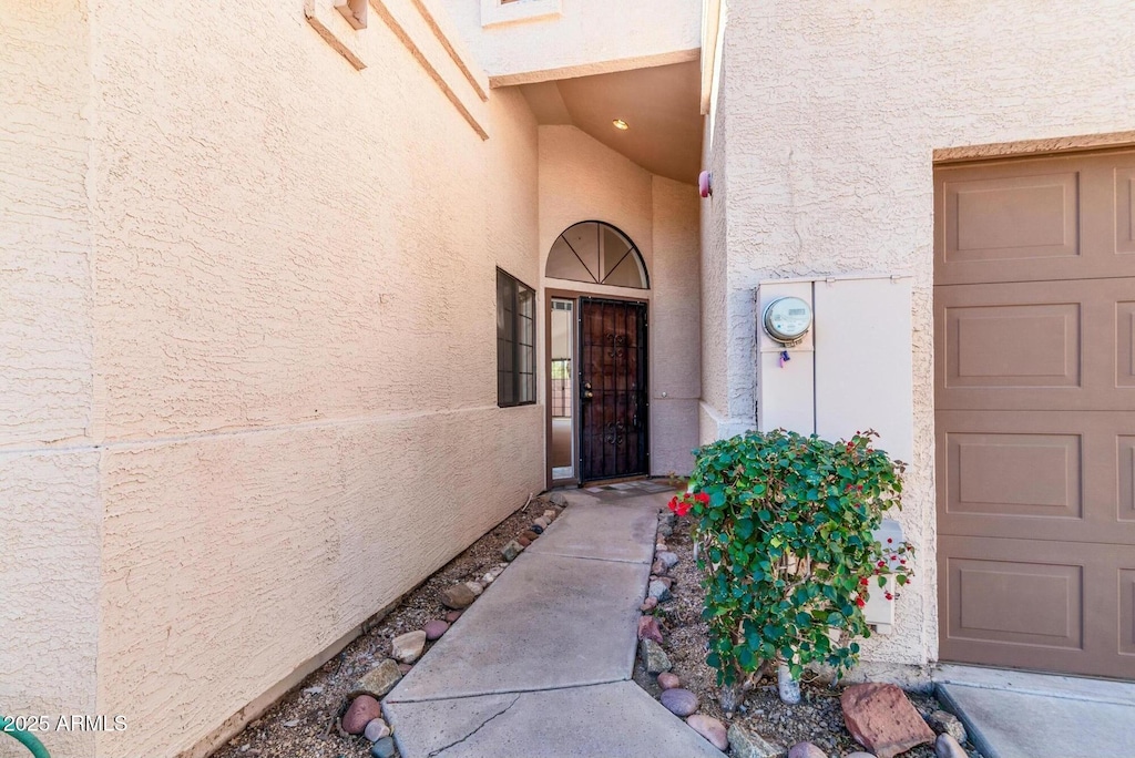 property entrance featuring a garage